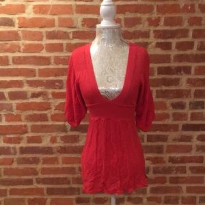 Bebe V-neck eyelet tunic w/kimono sleeves.